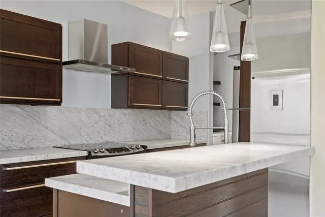 a kitchen with a sink and a refrigerator