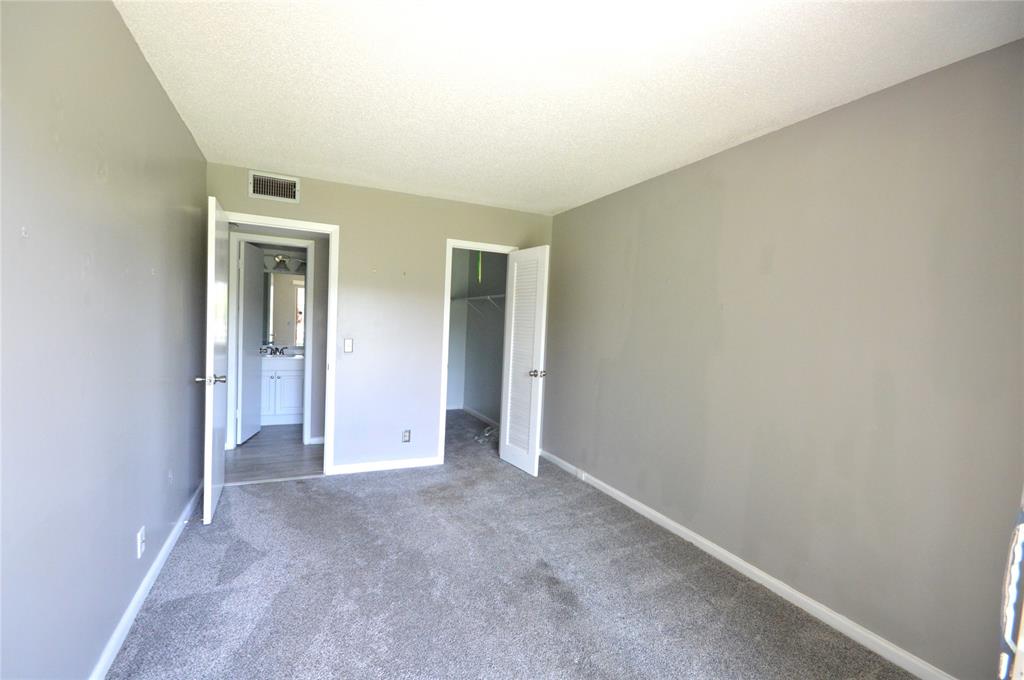 144 Mansfield D, Unit 144 Boca Raton, FL 33434 - Photo 19 of 37 a view of an empty room and closet