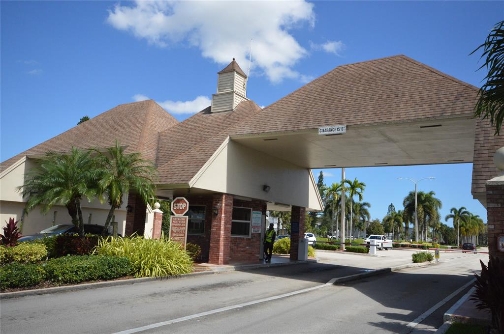 144 Mansfield D, Unit 144 Boca Raton, FL 33434 - Photo 21 of 37 a view of a building with potted plants