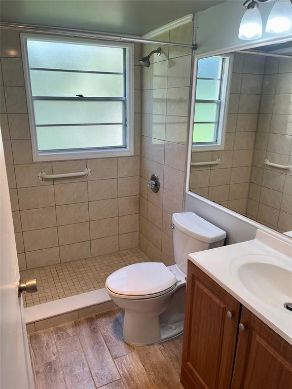 144 Mansfield D, Unit 144 Boca Raton, FL 33434 - Photo 33 of 37 a bathroom with a toilet and a shower