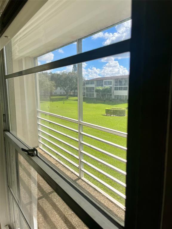 144 Mansfield D, Unit 144 Boca Raton, FL 33434 - Photo 36 of 37 a view of a room with a large window