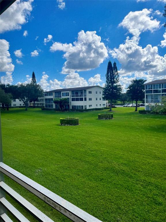 144 Mansfield D, Unit 144 Boca Raton, FL 33434 - Photo 37 of 37 a view of a house with a big yard