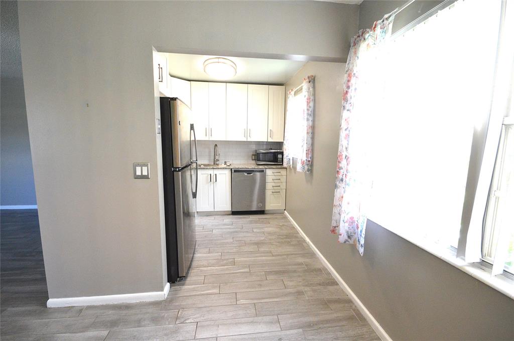 144 Mansfield D, Unit 144 Boca Raton, FL 33434 - Photo 8 of 37 a view of a kitchen with a sink and a window