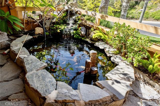 a view of a house with a tree