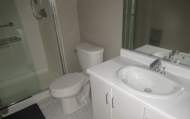 701 Forum Square, Unit 607 Glenview, IL 60025 - Photo 11 of 13 a bathroom with a sink toilet and shower