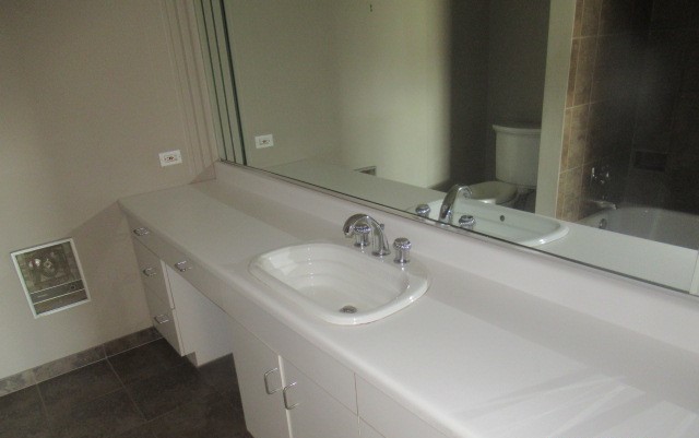 701 Forum Square, Unit 607 Glenview, IL 60025 - Photo 13 of 13 a bathroom with a sink and a mirror
