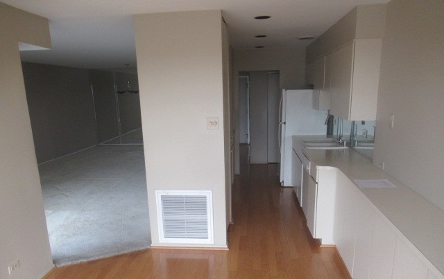 701 Forum Square, Unit 607 Glenview, IL 60025 - Photo 6 of 13 a kitchen with a sink a refrigerator and cabinets