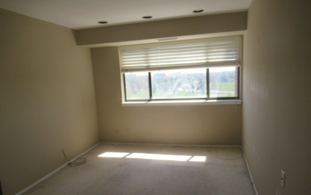 701 Forum Square, Unit 607 Glenview, IL 60025 - Photo 9 of 13 a view of an empty room with a window