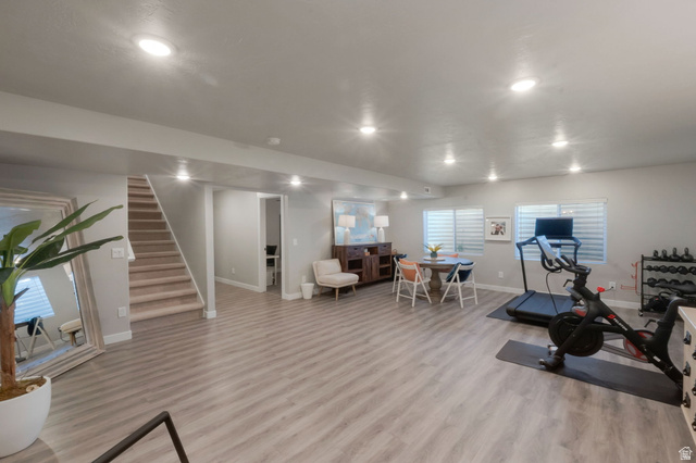 2319 North 3370 West Lehi, UT 84048 - Photo 26 of 30 Spacious lower-level area featuring wood-finish flooring, recessed lighting, and multiple windows with blinds