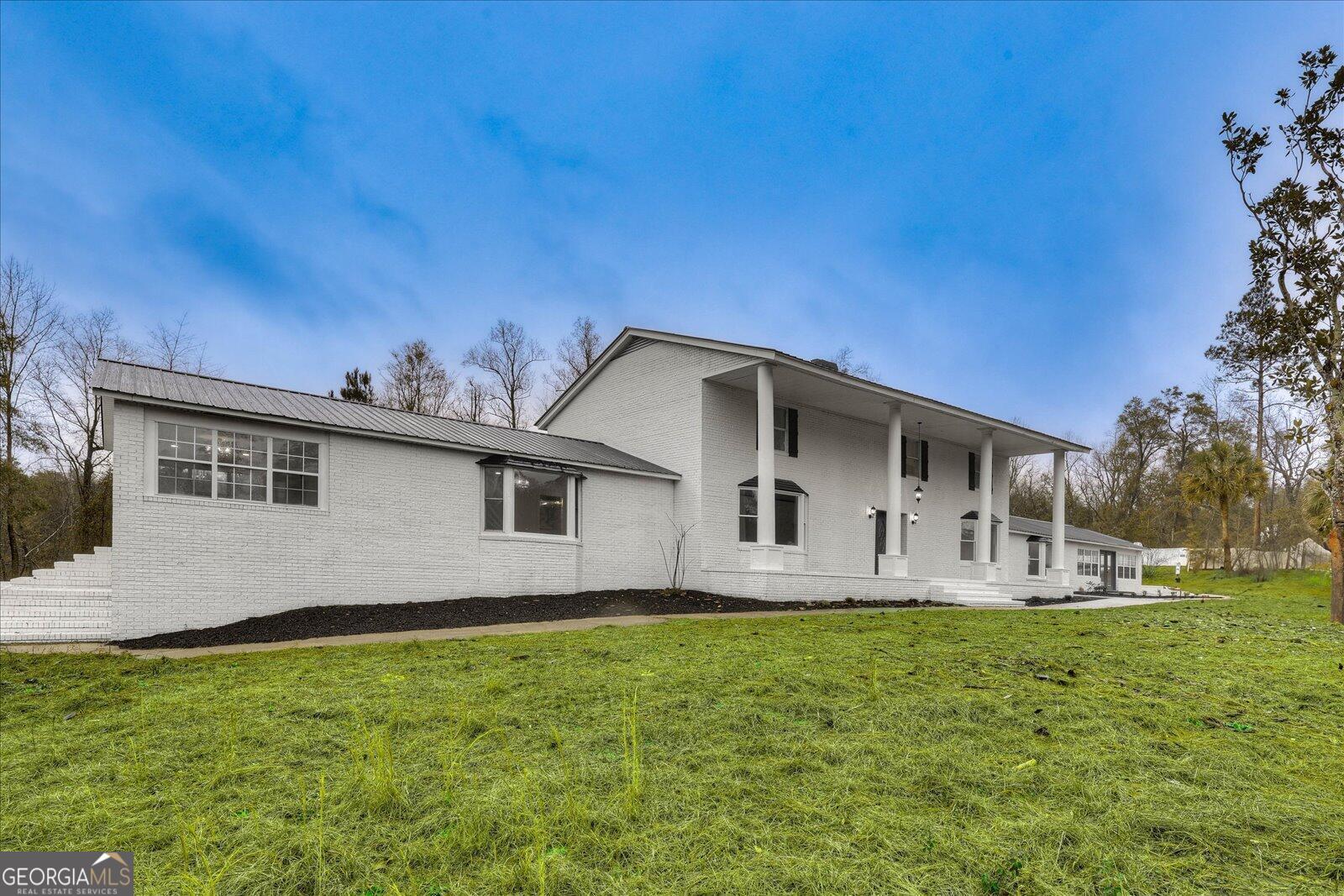 4756 Mike Padgett Highway Augusta, GA 30906 - Photo 1 of 28 a front view of a house with garden