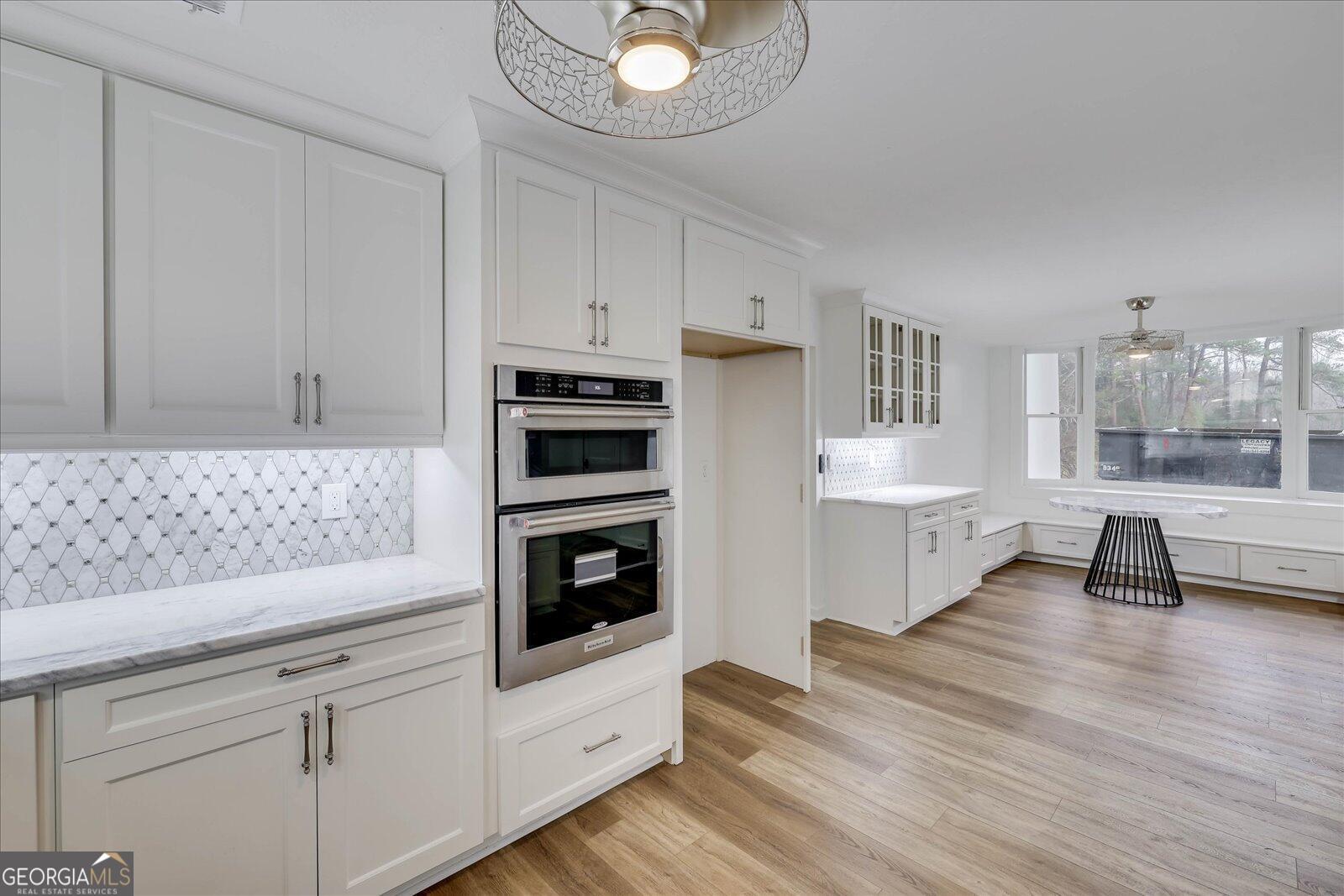 4756 Mike Padgett Highway Augusta, GA 30906 - Photo 15 of 28 a kitchen with white cabinets and appliances