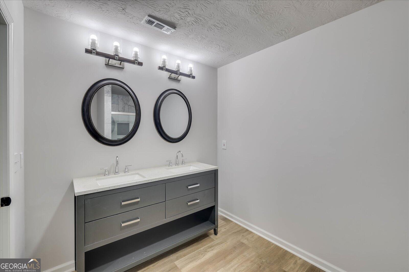 4756 Mike Padgett Highway Augusta, GA 30906 - Photo 23 of 28 a bathroom with a sink and a mirror