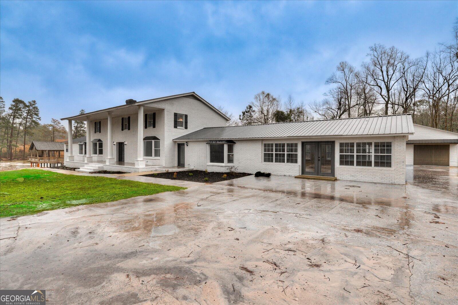 4756 Mike Padgett Highway Augusta, GA 30906 - Photo 26 of 28 a front view of a house with a yard