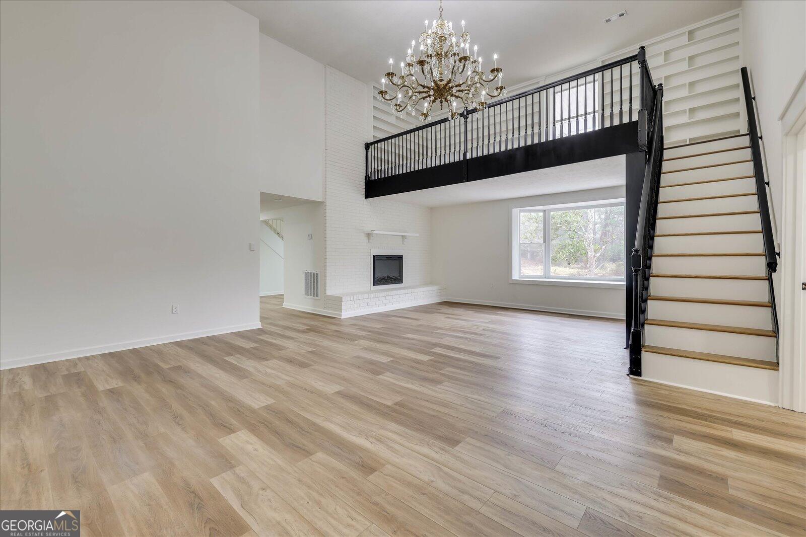 4756 Mike Padgett Highway Augusta, GA 30906 - Photo 3 of 28 a view of empty room with wooden floor and fan