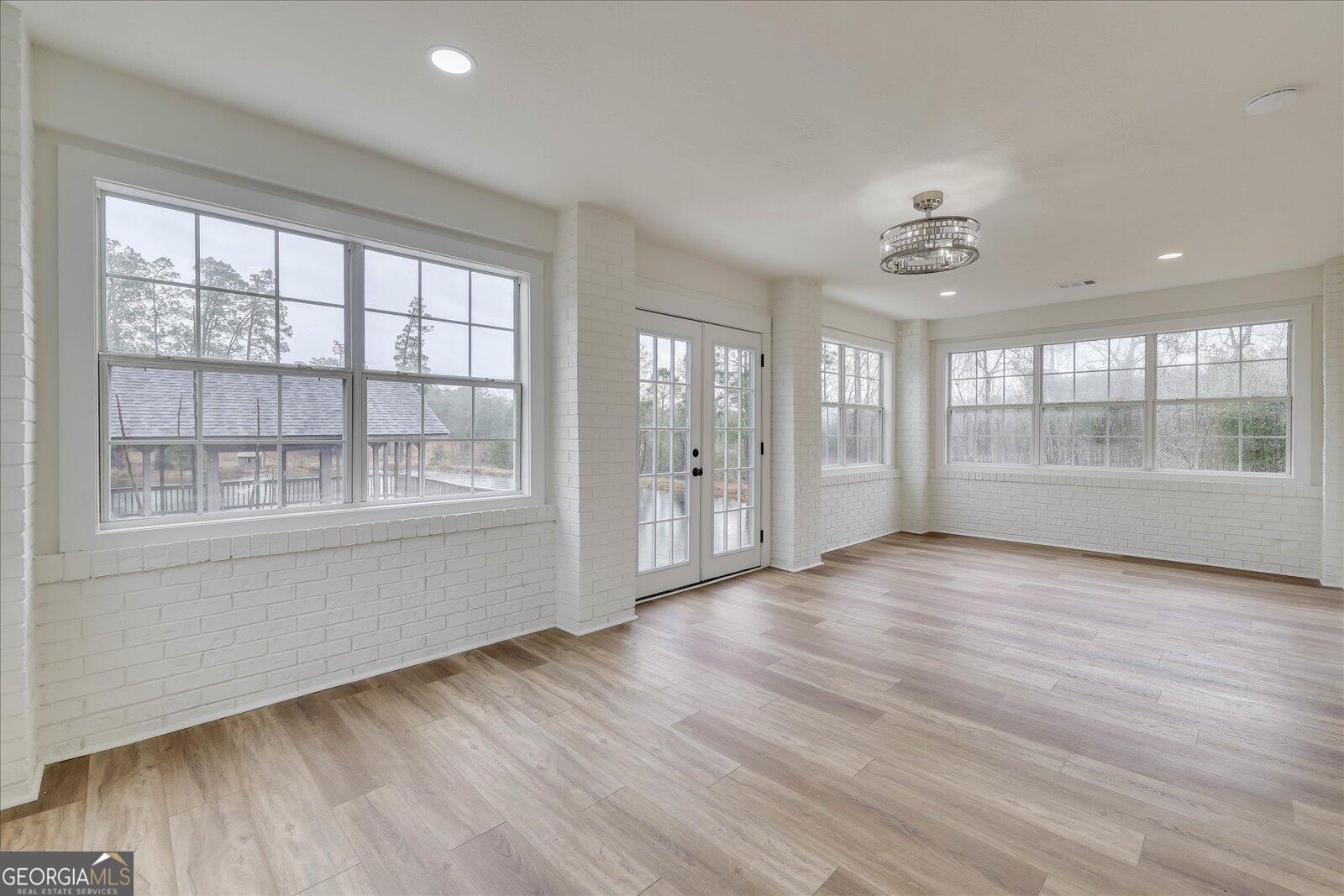 4756 Mike Padgett Highway Augusta, GA 30906 - Photo 8 of 28 a view of an empty room with a window and wooden floor