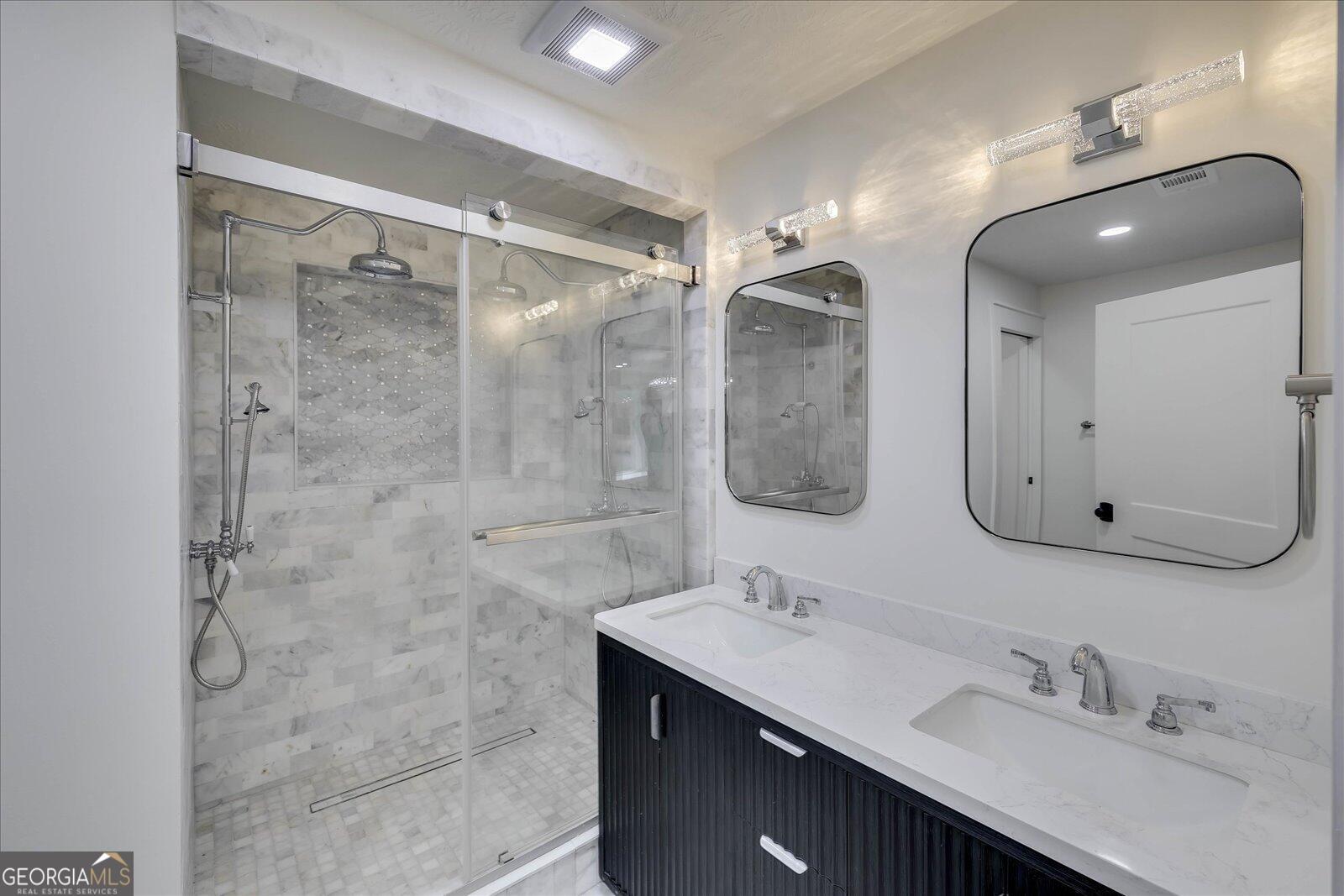 4756 Mike Padgett Highway Augusta, GA 30906 - Photo 9 of 28 a bathroom with a double vanity sink mirror and shower