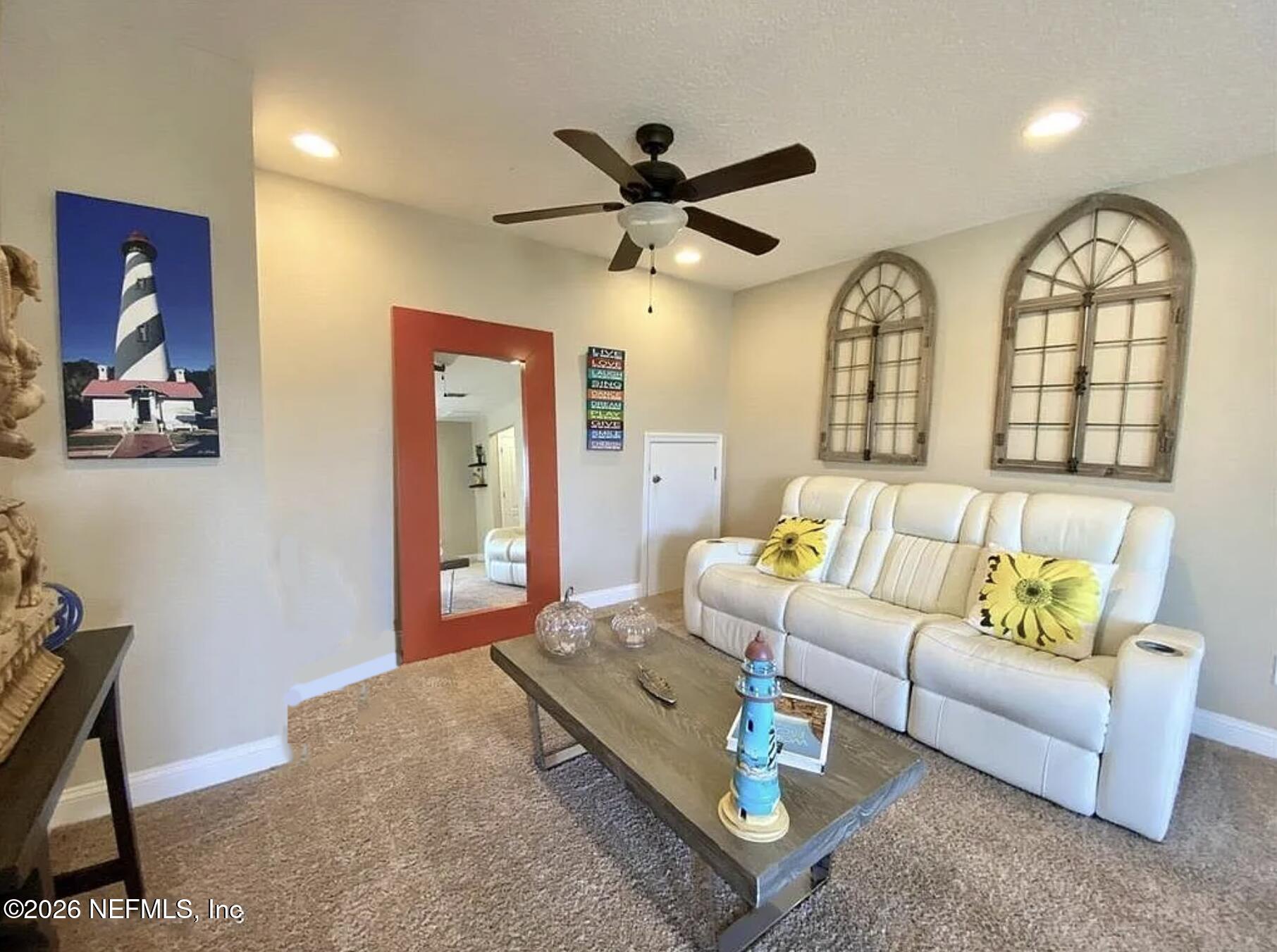 115 Sierras Loop St. Augustine, FL 32086 - Photo 37 of 65 a living room with furniture a bed and a chandelier