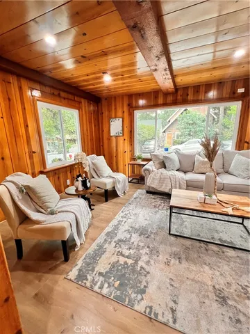 a balcony with furniture and a large window