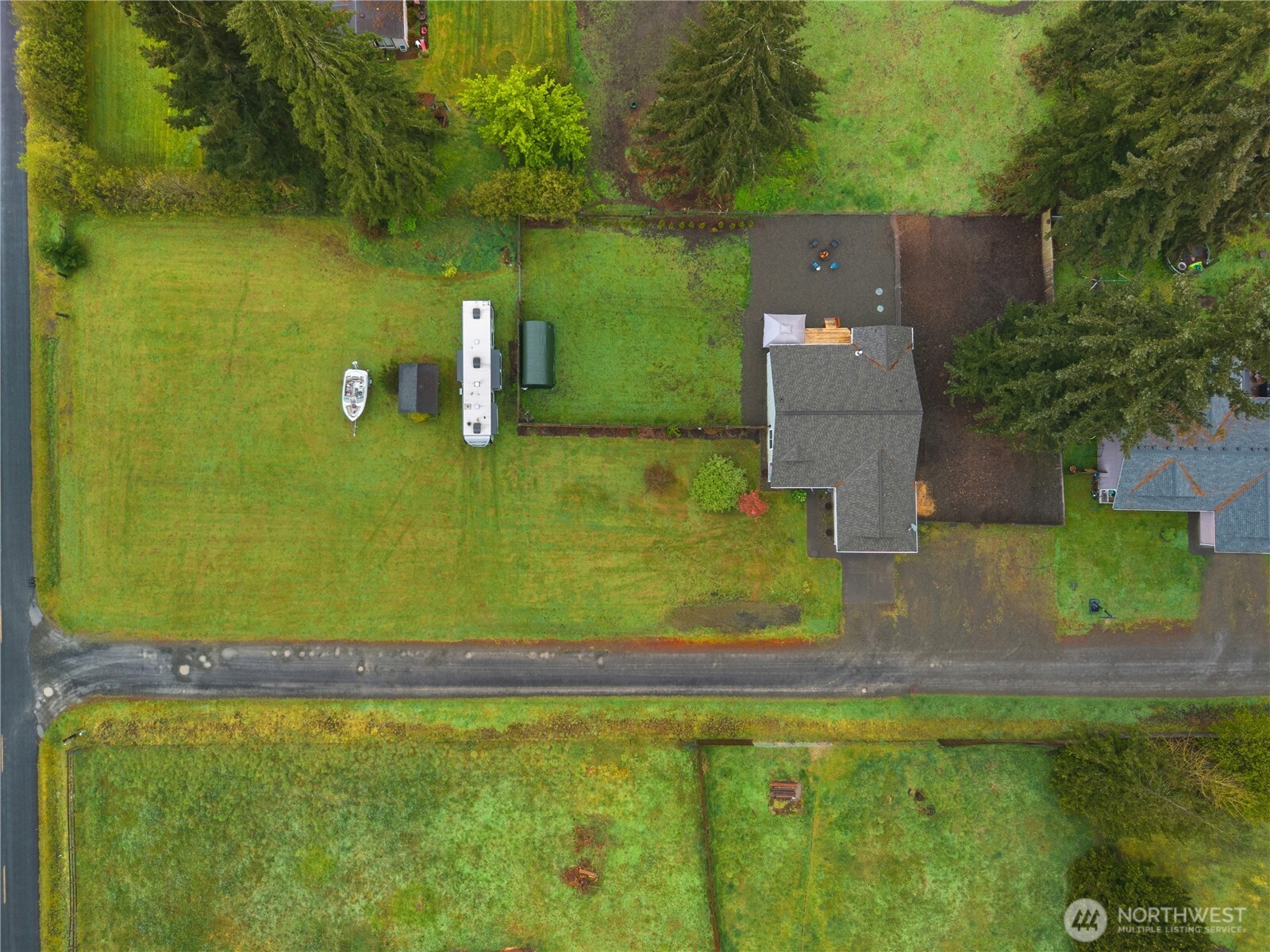 7606 187th Avenue Southwest Rochester, WA 98579 - Photo 28 of 28 an aerial view of a house with a yard