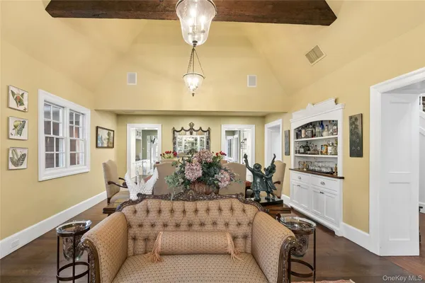 a living room with furniture fireplace and a window