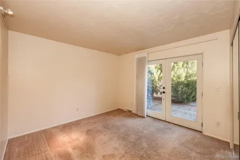 a bathroom with a sink a toilet a mirror and bathtub