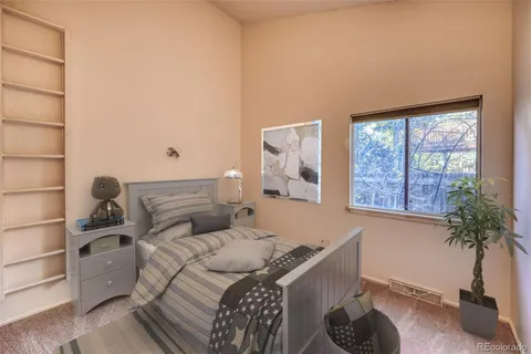 a living room with furniture a rug and a table