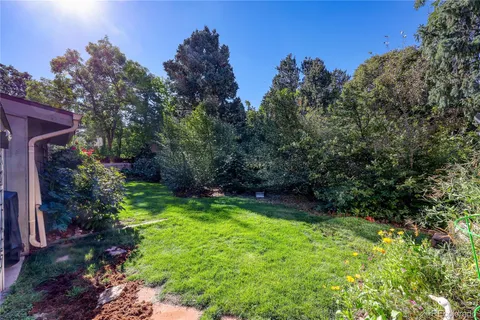 an aerial view of house with outdoor space and swimming pool