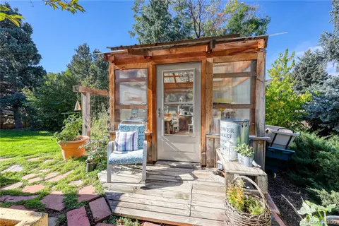a front view of a house with outdoor seating and plants