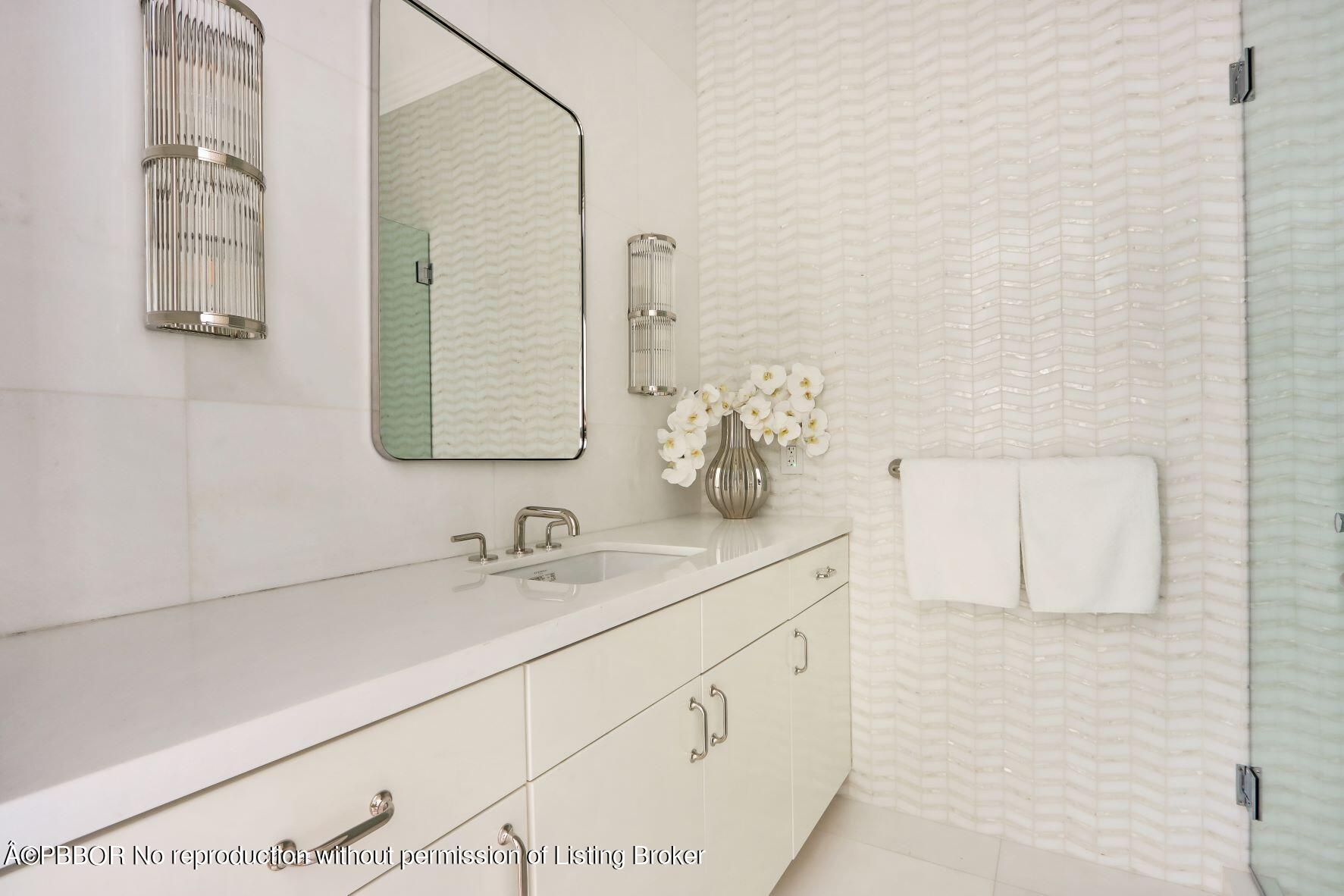 215 Indian Road Palm Beach, FL 33480 - Photo 16 of 32 a bathroom with a sink and a mirror
