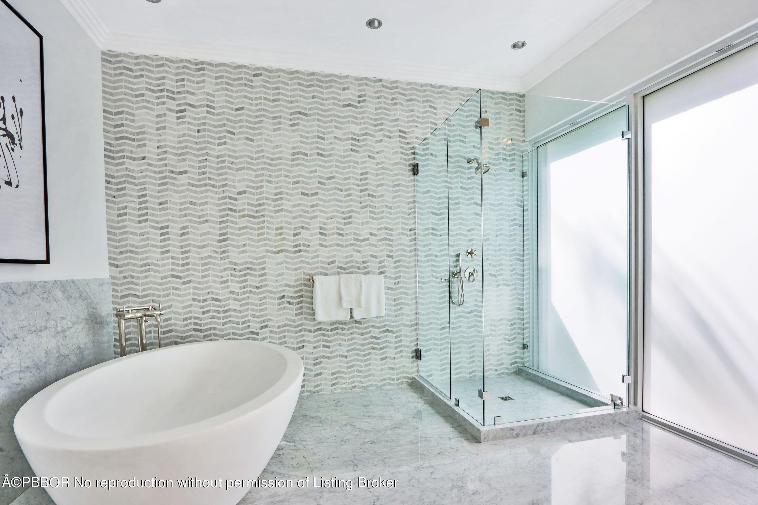 215 Indian Road Palm Beach, FL 33480 - Photo 19 of 32 a bathroom with a bathtub and shower