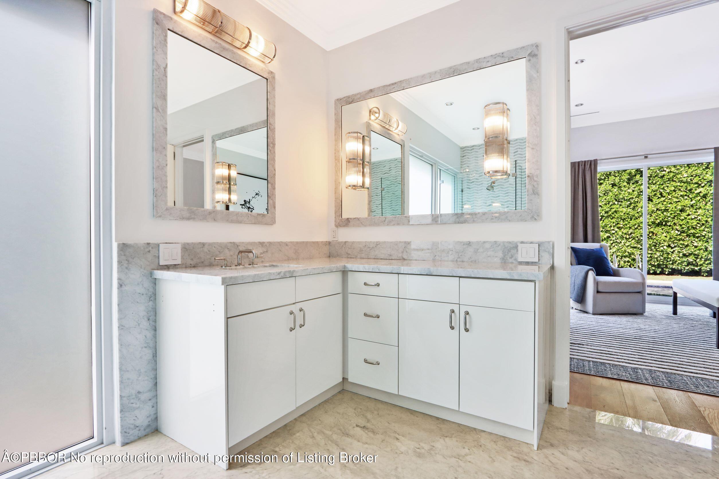 215 Indian Road Palm Beach, FL 33480 - Photo 20 of 32 a bathroom with a granite countertop sink mirror and window