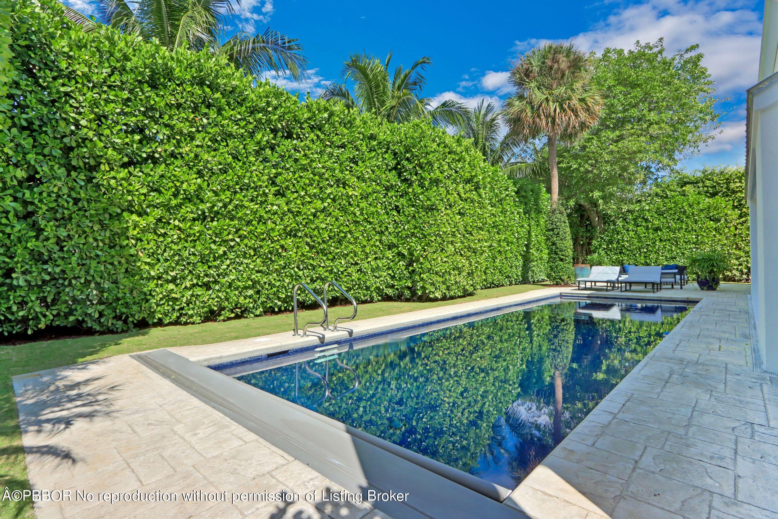 215 Indian Road Palm Beach, FL 33480 - Photo 28 of 32 a view of a backyard with plants