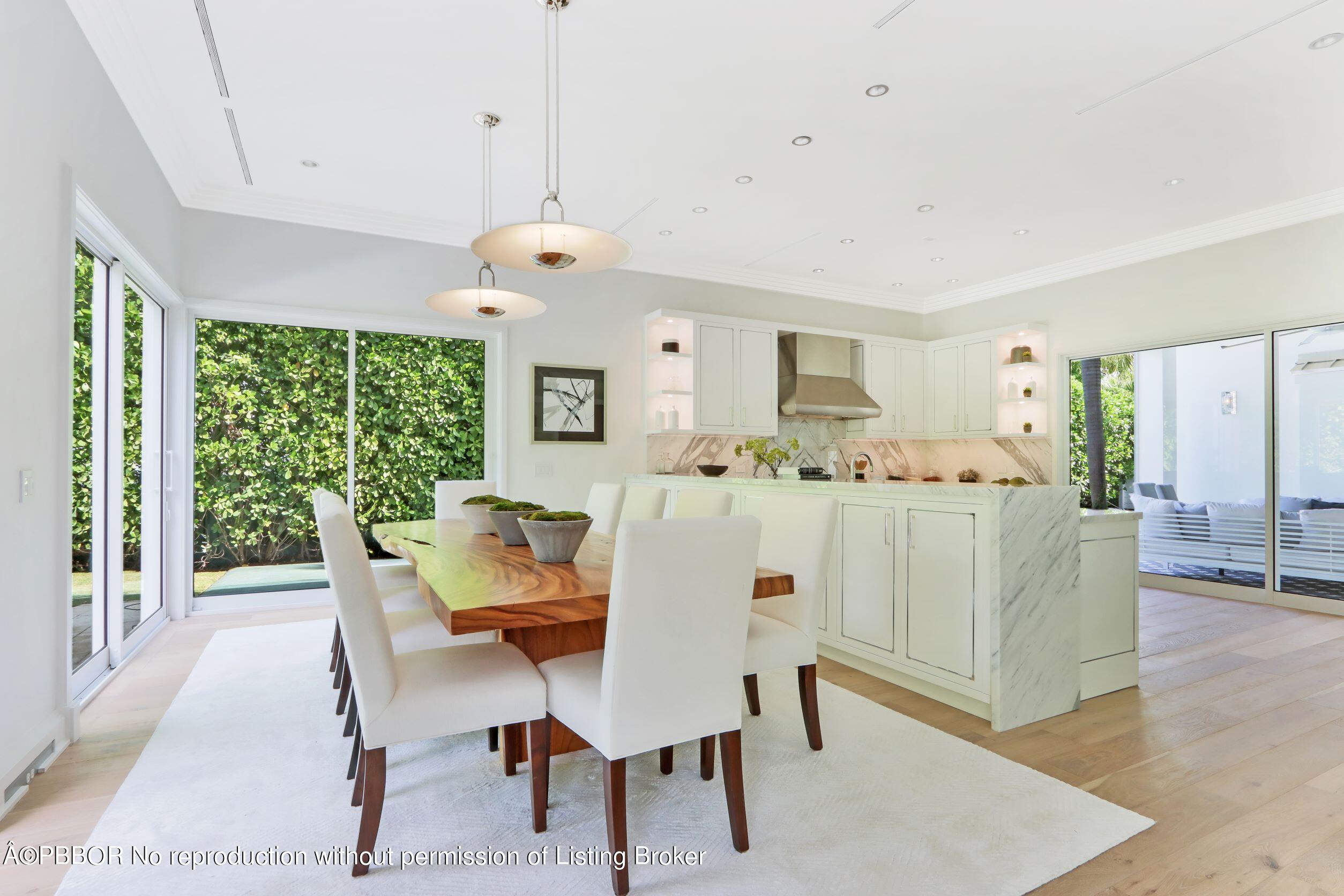 215 Indian Road Palm Beach, FL 33480 - Photo 8 of 32 a view of a dining room with furniture window and wooden floor