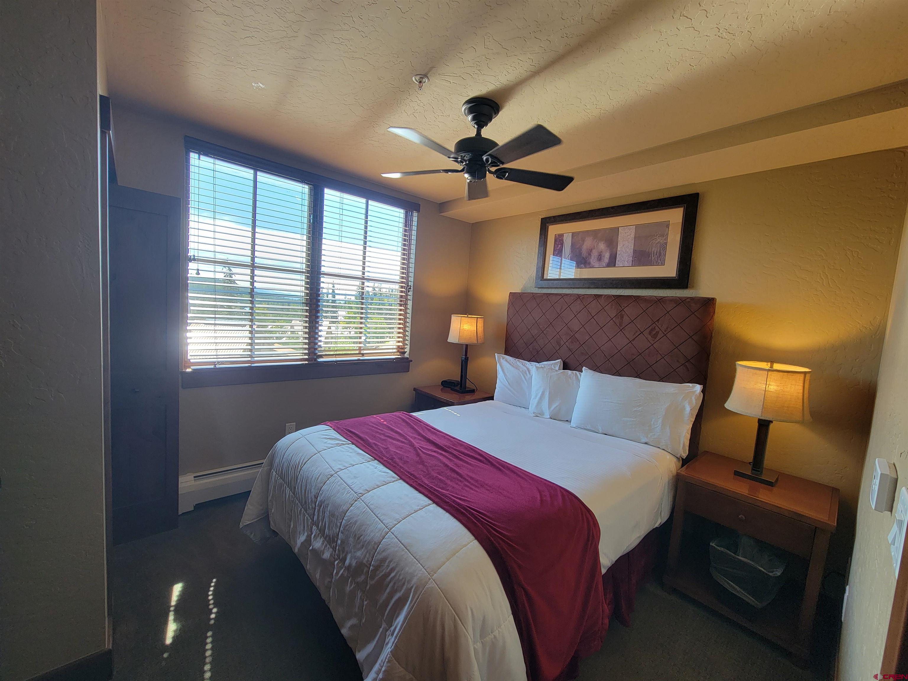 24 Sheol Street, Unit 101D Durango, CO 81301 - Photo 18 of 32 a bedroom with a bed and a window