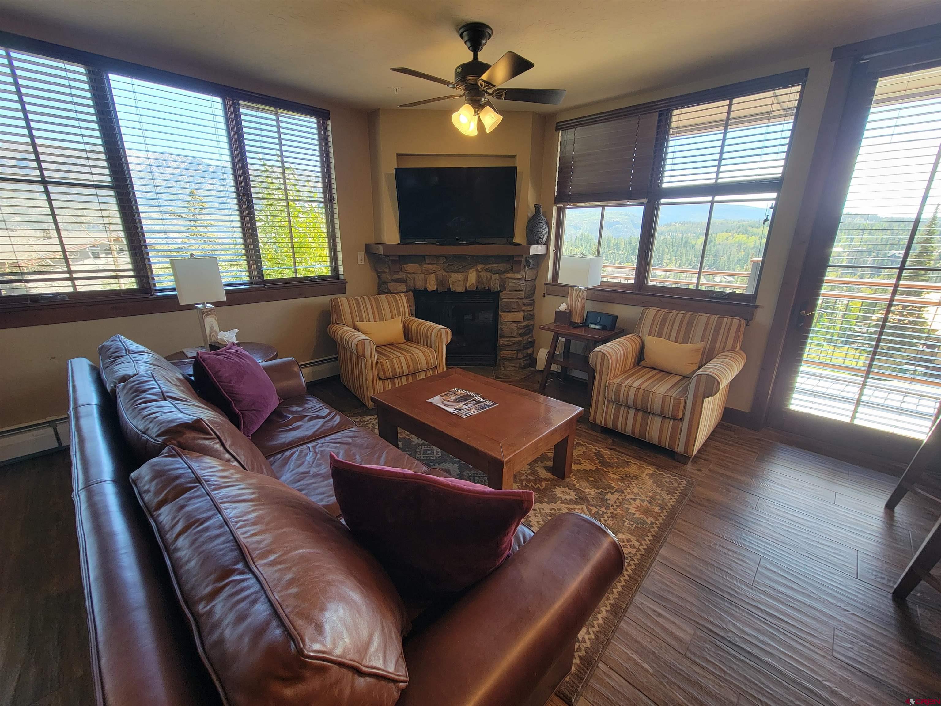 24 Sheol Street, Unit 101D Durango, CO 81301 - Photo 4 of 32 a living room with furniture and a flat screen tv