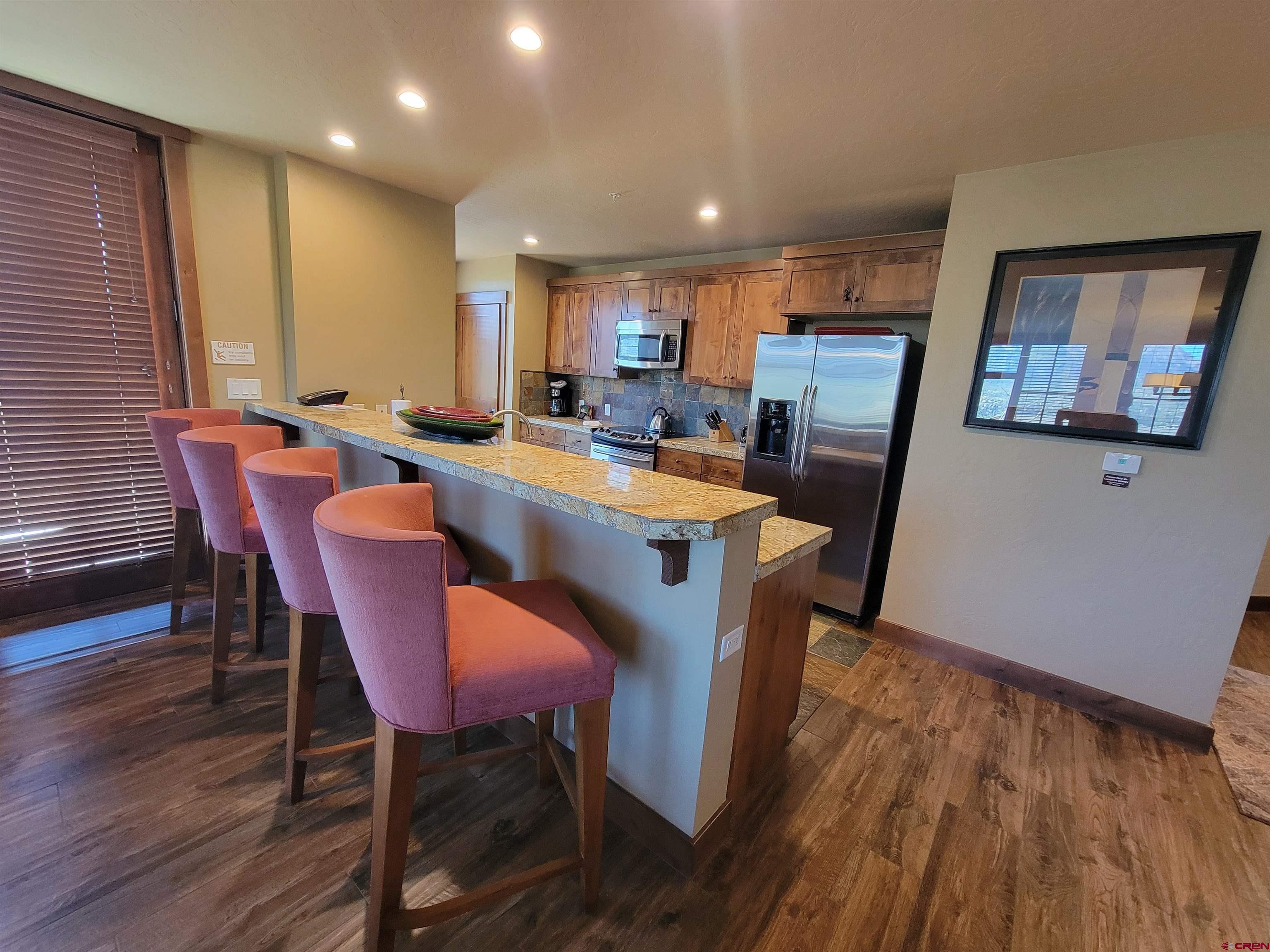 24 Sheol Street, Unit 101D Durango, CO 81301 - Photo 9 of 32 a view of a dining room with furniture and wooden floor