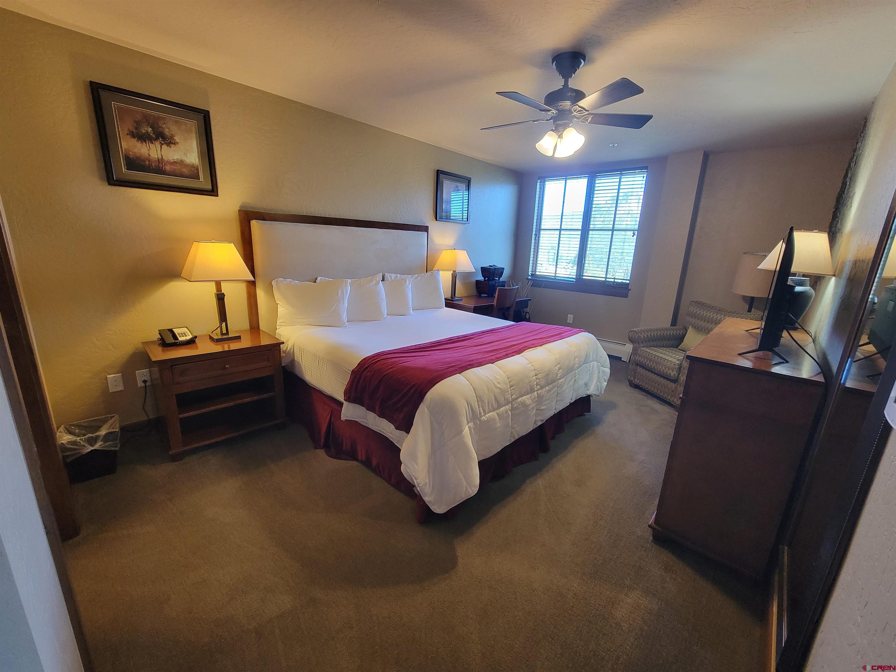 24 Sheol Street, Unit 101D Durango, CO 81301 - Photo 10 of 32 a bed room with a bed and a ceiling fan