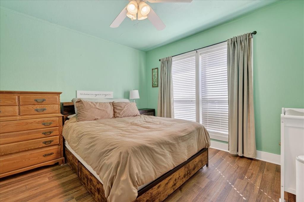 124 West Travis Dublin, TX 76446 - Photo 14 of 30 a bedroom with a bed and a window