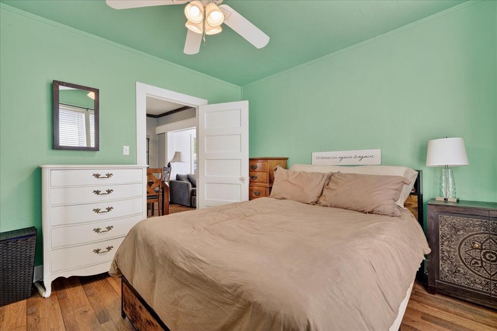 124 West Travis Dublin, TX 76446 - Photo 16 of 30 a bedroom with a bed and a dresser