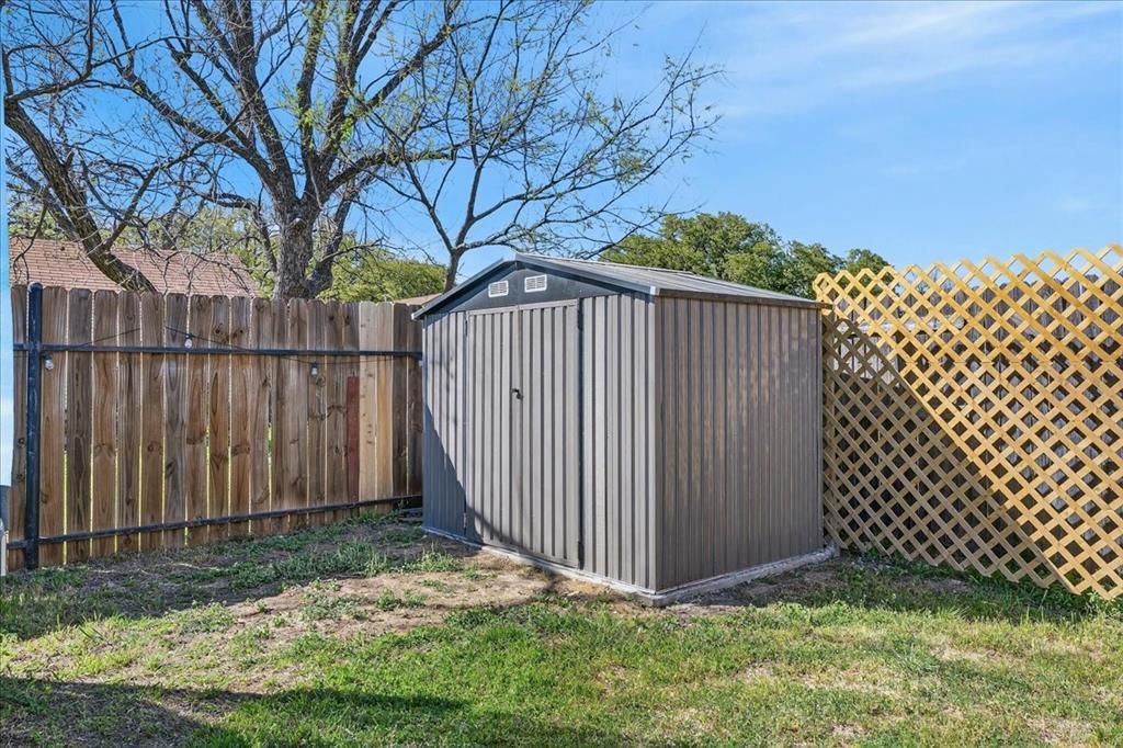 124 West Travis Dublin, TX 76446 - Photo 26 of 30 a view of a wooden fence