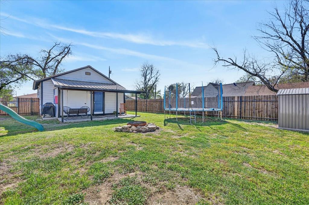 124 West Travis Dublin, TX 76446 - Photo 29 of 30 a house view with a garden space