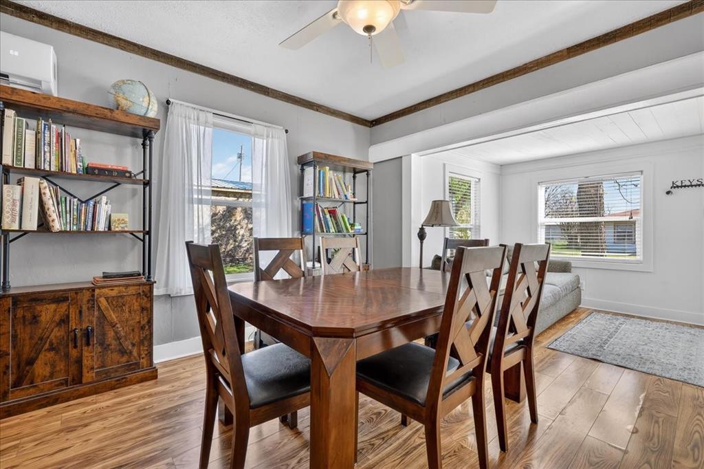 124 West Travis Dublin, TX 76446 - Photo 9 of 30 a view of a dining room with furniture and a potted plant