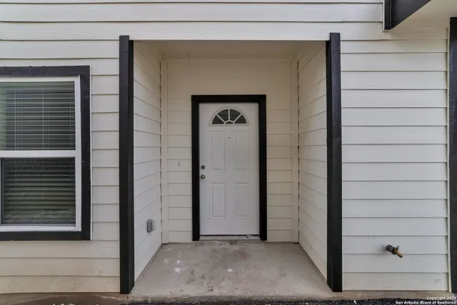 a view of a door and a window