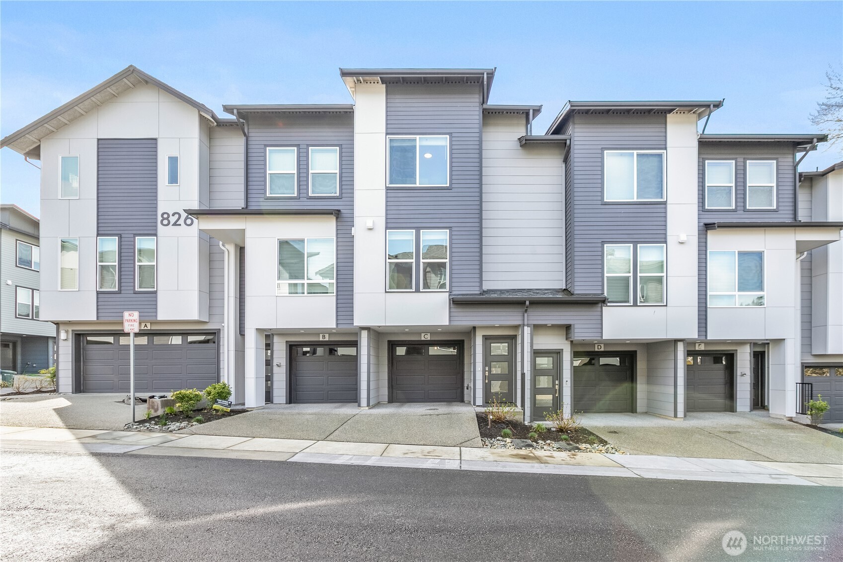 826 238th Place Southeast, Unit C Bothell, WA 98021 - Photo 1 of 1 a front view of a building with a street