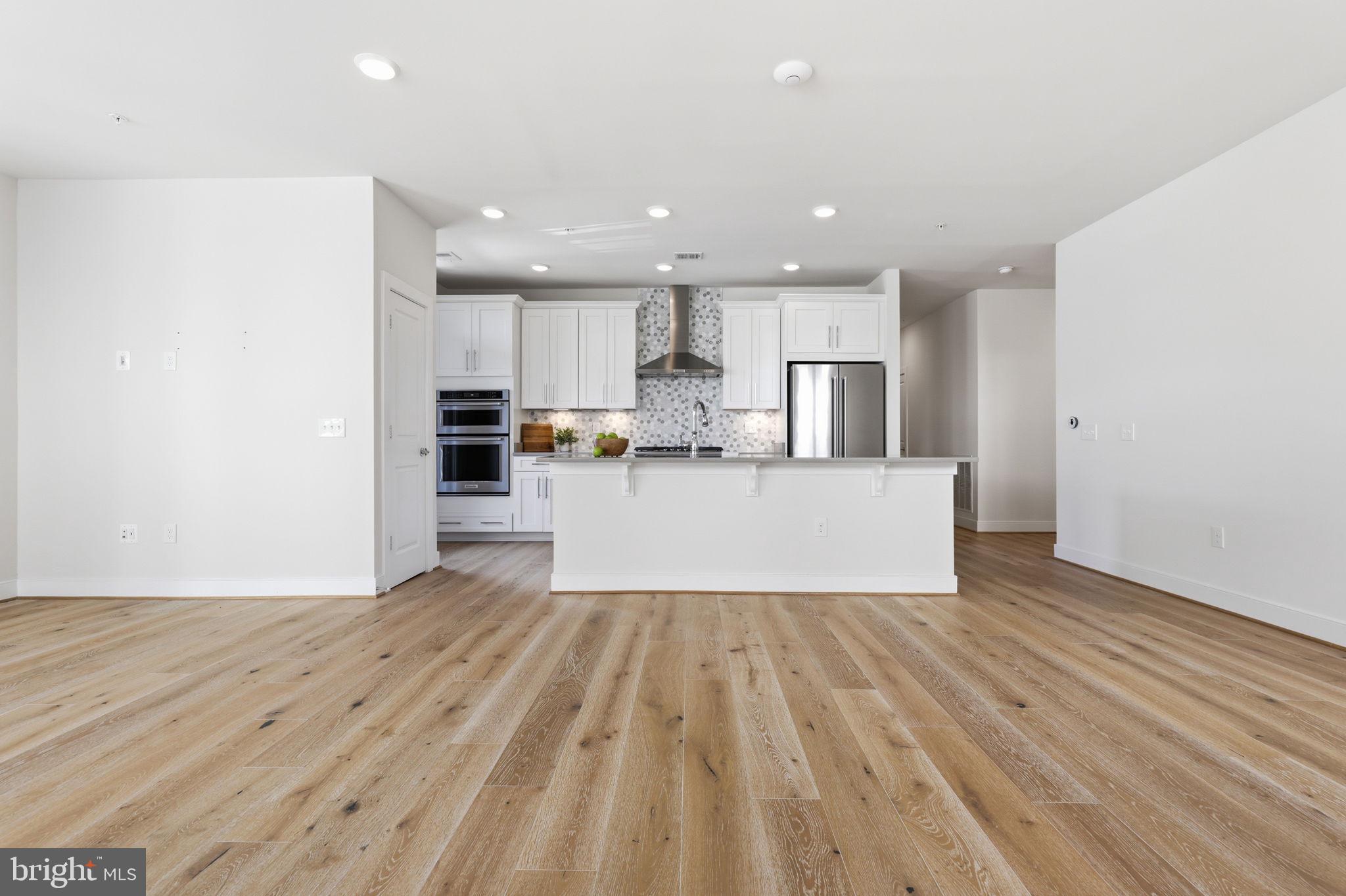 11200 Reston Station Boulevard, Unit 205 Reston, VA 20190 - Photo 13 of 39 Living and Dining