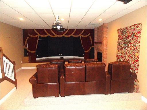 348 Firth Road Inverness, IL 60067 - Photo 13 of 16 a black leather couch sitting in a room