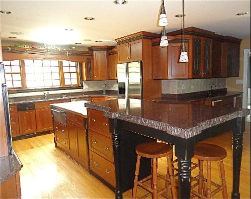 348 Firth Road Inverness, IL 60067 - Photo 4 of 16 a kitchen with stainless steel appliances granite countertop a sink and cabinets