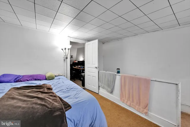 a bedroom with a bed and a walk in closet