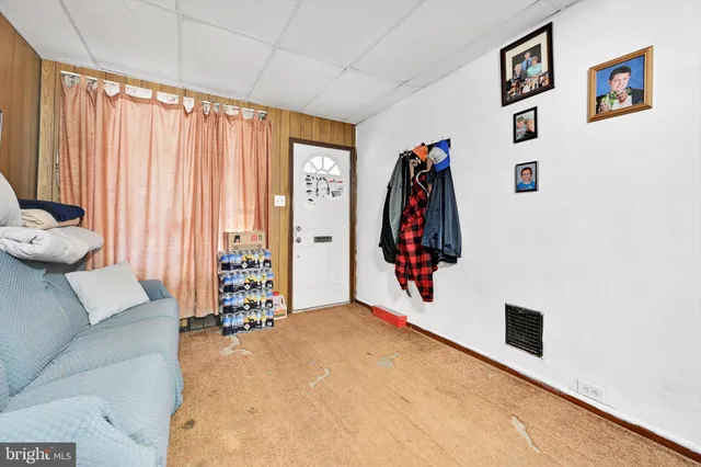 a view of a livingroom with furniture and a window
