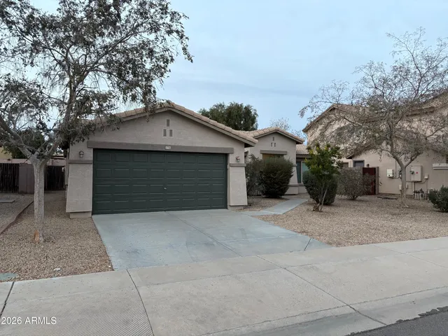 a front view of a house with a garage